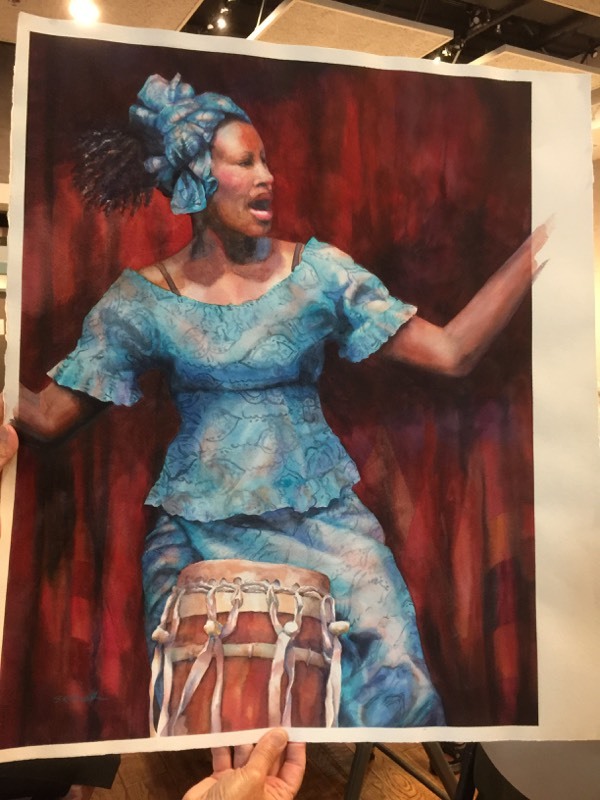 Woman in blue with a drum